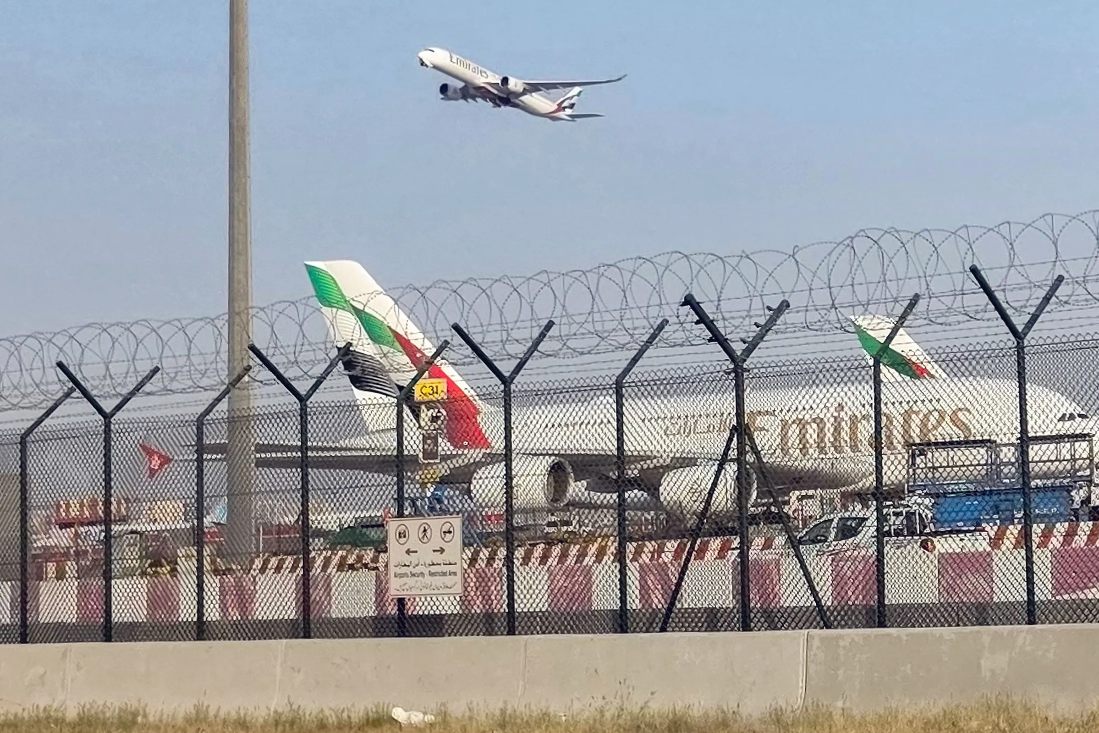 An Emirates aircraft takes off from Dubai International Airport.