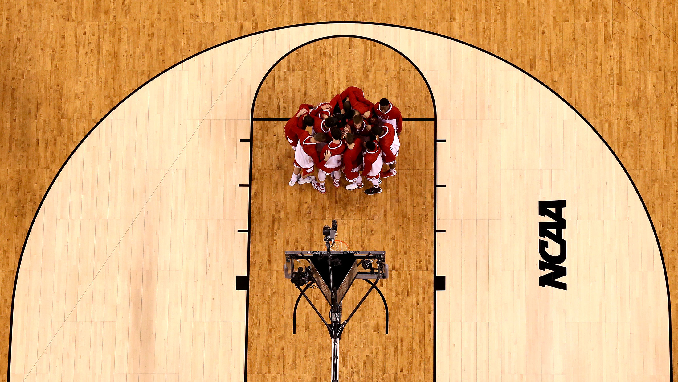 The Wisconsin Badgers huddle before taking on the Duke Blue Devils in the NCAA championship game on April 6 at Lucas Oil Stadium in Indianapolis.
