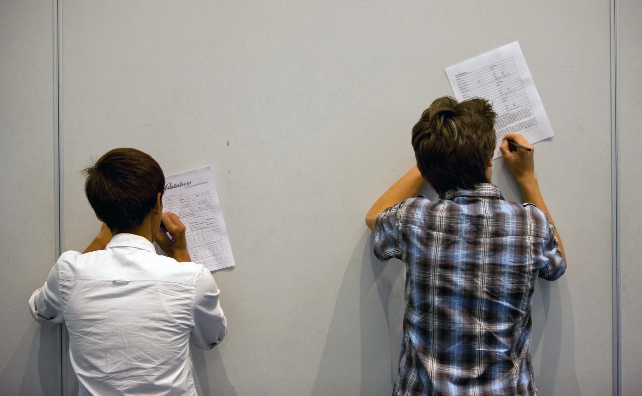 Jack Hernandez, 18 right, and Kuangkye Oo, 17 and left, fill out an application at The Summer Youth Jobs &amp; Training Expo 2012 held in the Colorado Convention Center in Denver, Colorado, U.S.
