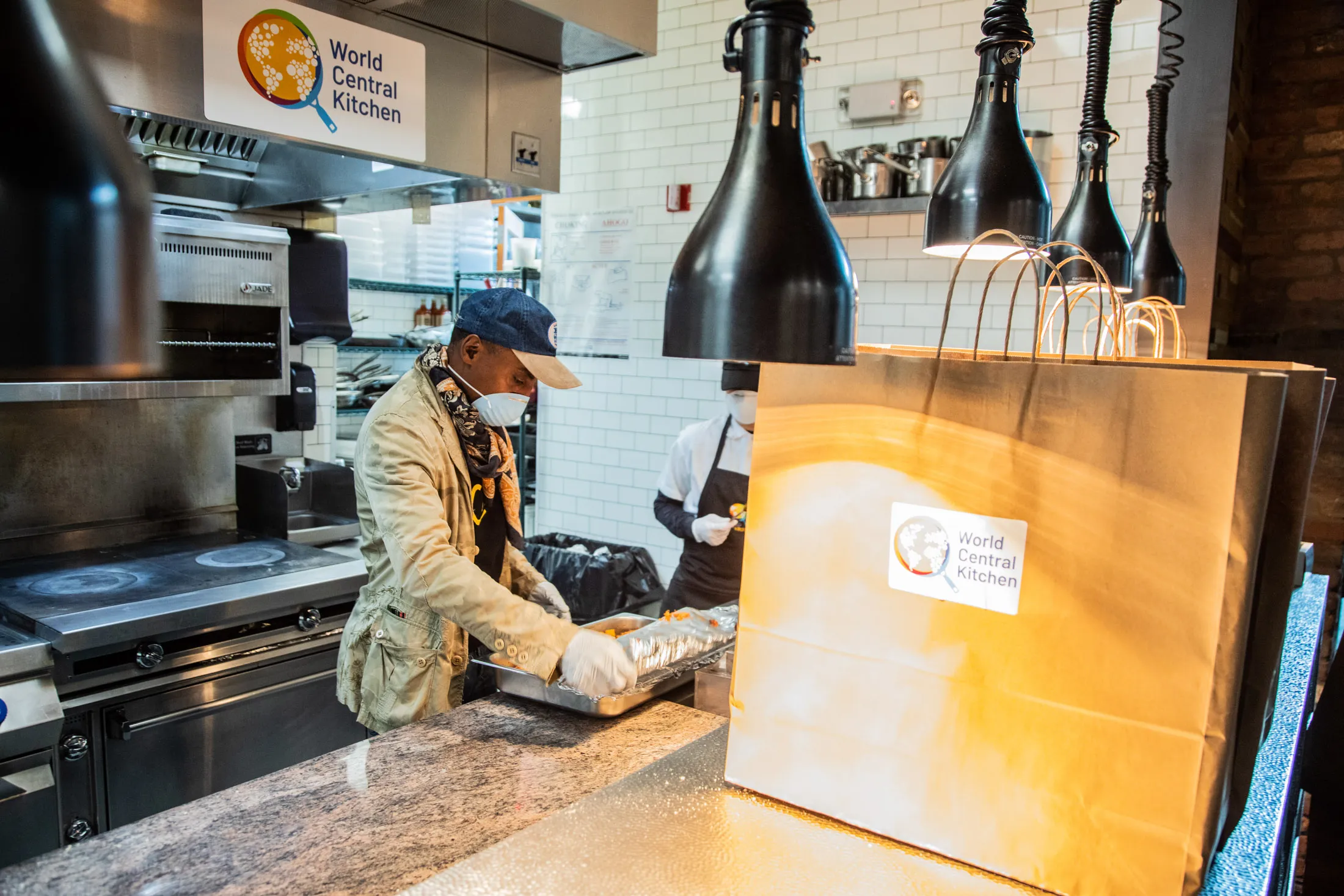 Chef Marcus Samuelsson packs&nbsp;food for Newark Working Kitchens.
