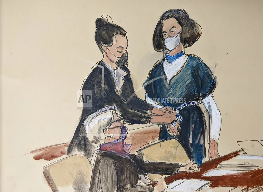 In this courtroom sketch, Ghislaine Maxwell stands facing her attorney Bobbi Sternheim while a U.S. marshal removes her shackles in the courtroom prior to a hearing in New York on&nbsp;Nov. 1.
