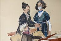 In this courtroom sketch, Ghislaine Maxwell stands facing her attorney Bobbi Sternheim while a U.S. marshal removes her shackles in the courtroom prior to a hearing in New York on Nov. 1.