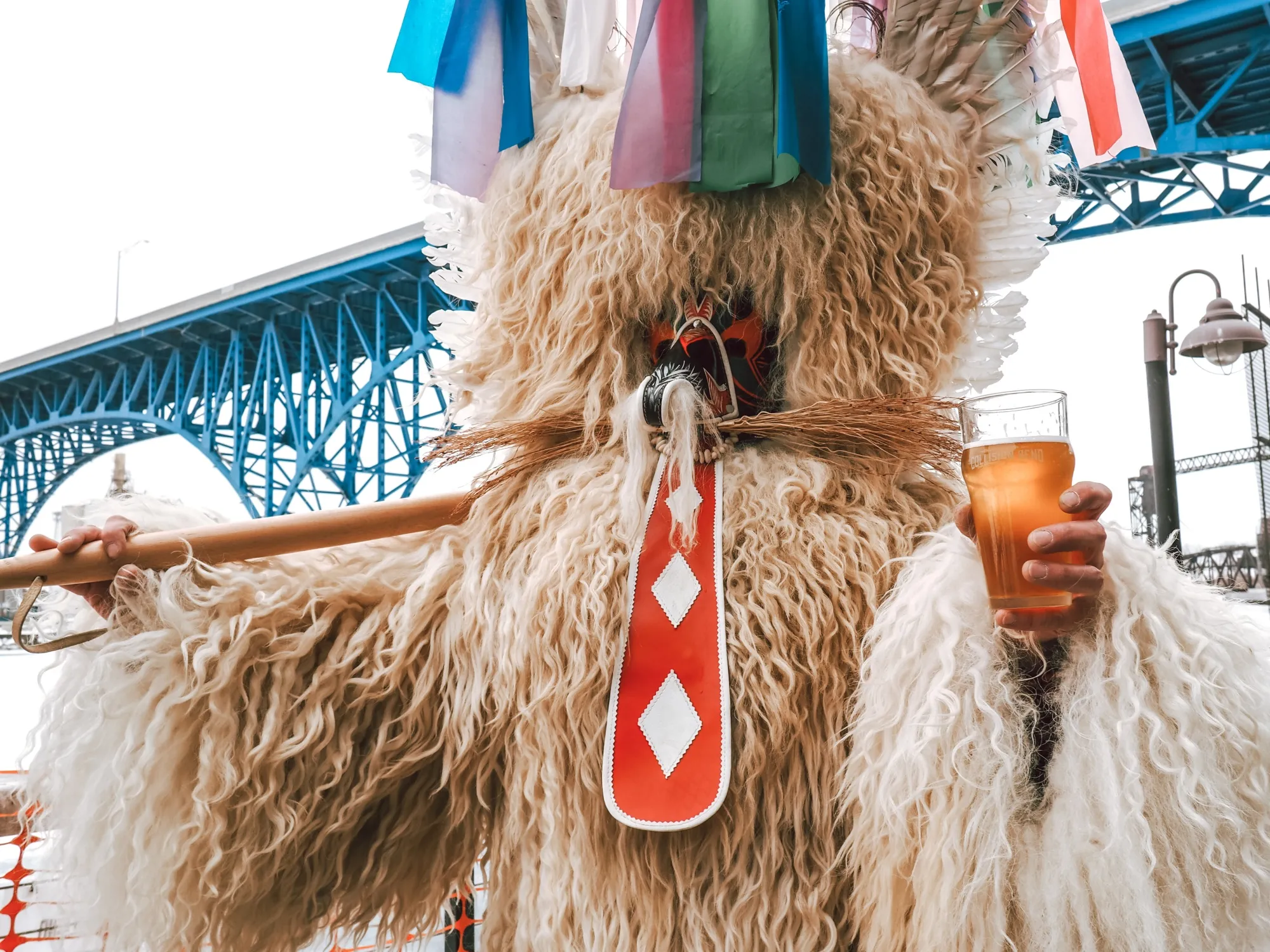 A club- and beer-wielding Kurent tries to scare away winter at Cleveland Kurentovanje. 
