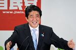Shinzo Abe, Japan's prime minister and president of the Liberal Democratic Party, gestures as he speaks during a news conference following a victory in the upper house elections at the LDP headquarters in Tokyo on July 22