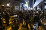 Riot police stand guard near the Lan Kwai Fong area in the Central district of Hong Kong, China, on Thursday, Oct. 31, 2019.