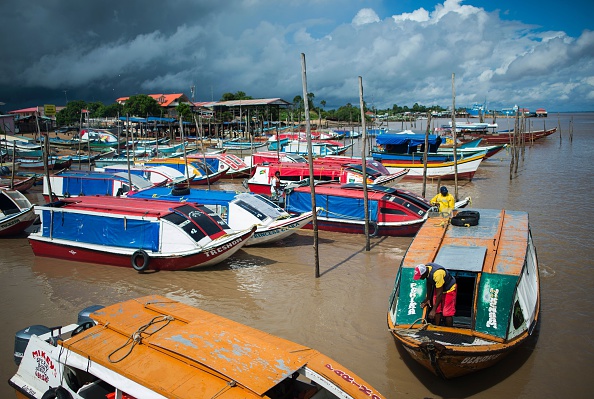 River taxis wait for customers at the dock in the town of Parika, Guyana.&nbsp;