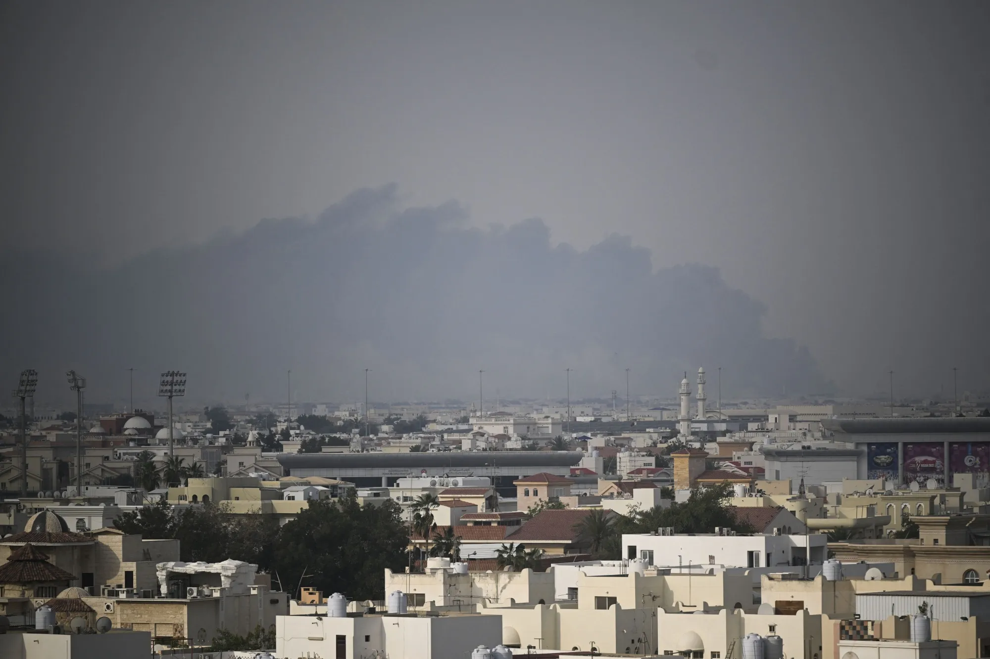 A plume of smoke rises following a reported Iranian strike in Doha on March 1, 2026.&nbsp;