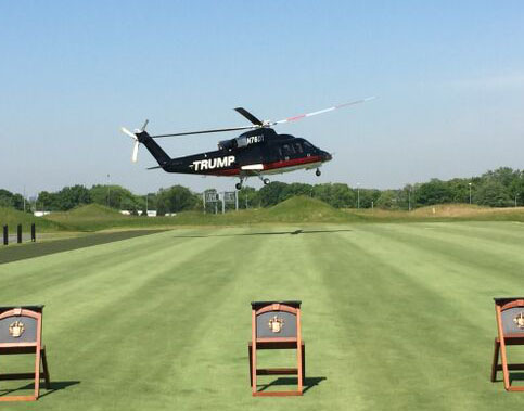 An empty helicopter arrives at the opening ceremonies.