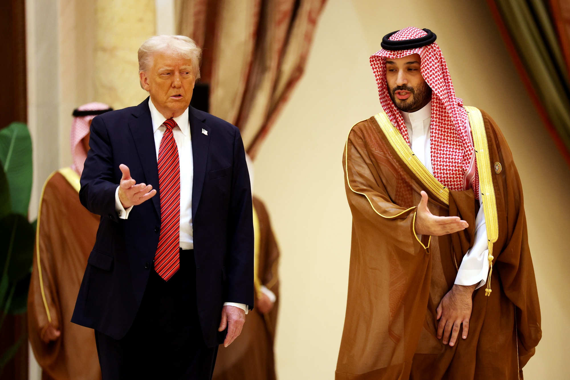 RIYADH, SAUDI ARABIA - MAY 14: U.S. President Donald Trump and Saudi Crown Prince Mohammed bin Salman speak as they arrive during the Gulf Cooperation Council (GCC) Leaders’ Summit at The Ritz-Carlton on May 14, 2025 in Riyadh, Saudi Arabia. The council addresses regional stability, defense cooperation, and energy policy among Gulf nations. Trump is on a multi-nation tour of the Gulf region focused on expanding economic ties and reinforcing security cooperation with key U.S. allies. (Photo by Win McNamee&#x2F;Getty Images) Photographer: Win McNamee&#x2F;Getty Images Europe