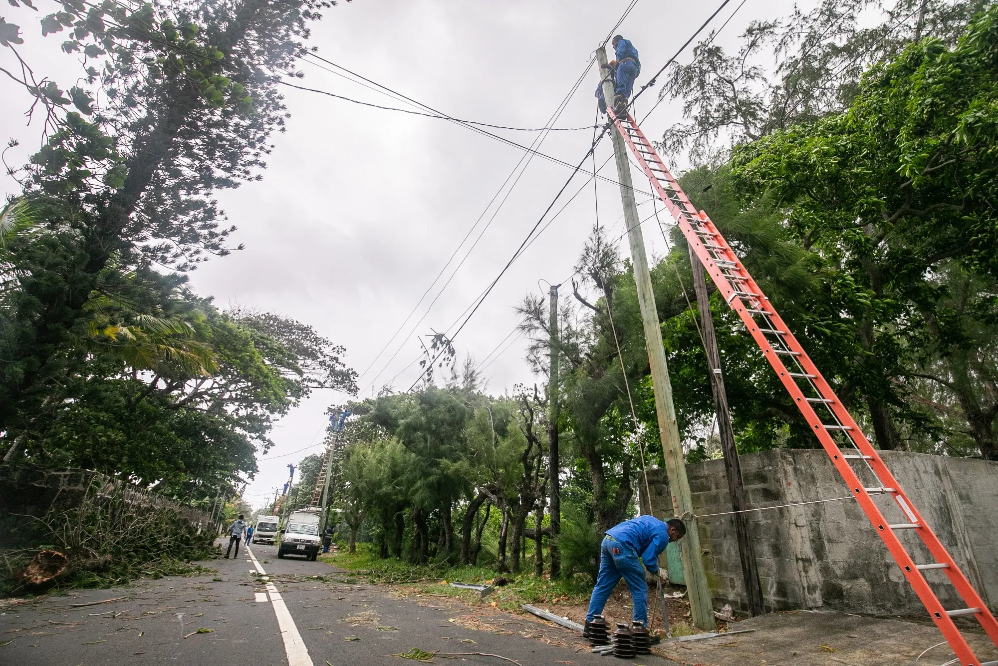 Mauritius Central Electricity Board employees repair a power line in Pointe d'Esny.