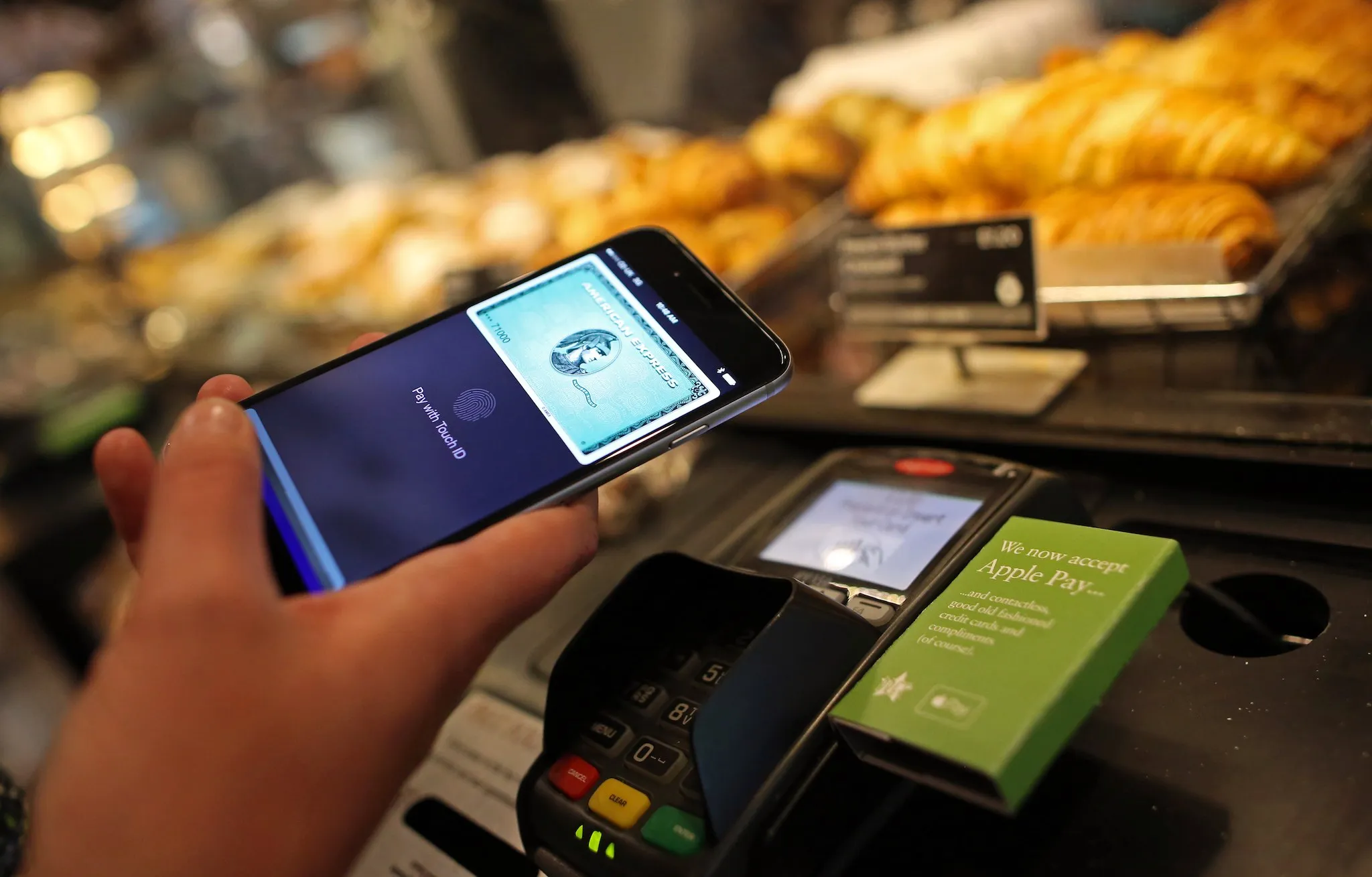 A customer using Apple Pay, via an American Express account, on an iPhone spends at a Pret A Manger store in London.
