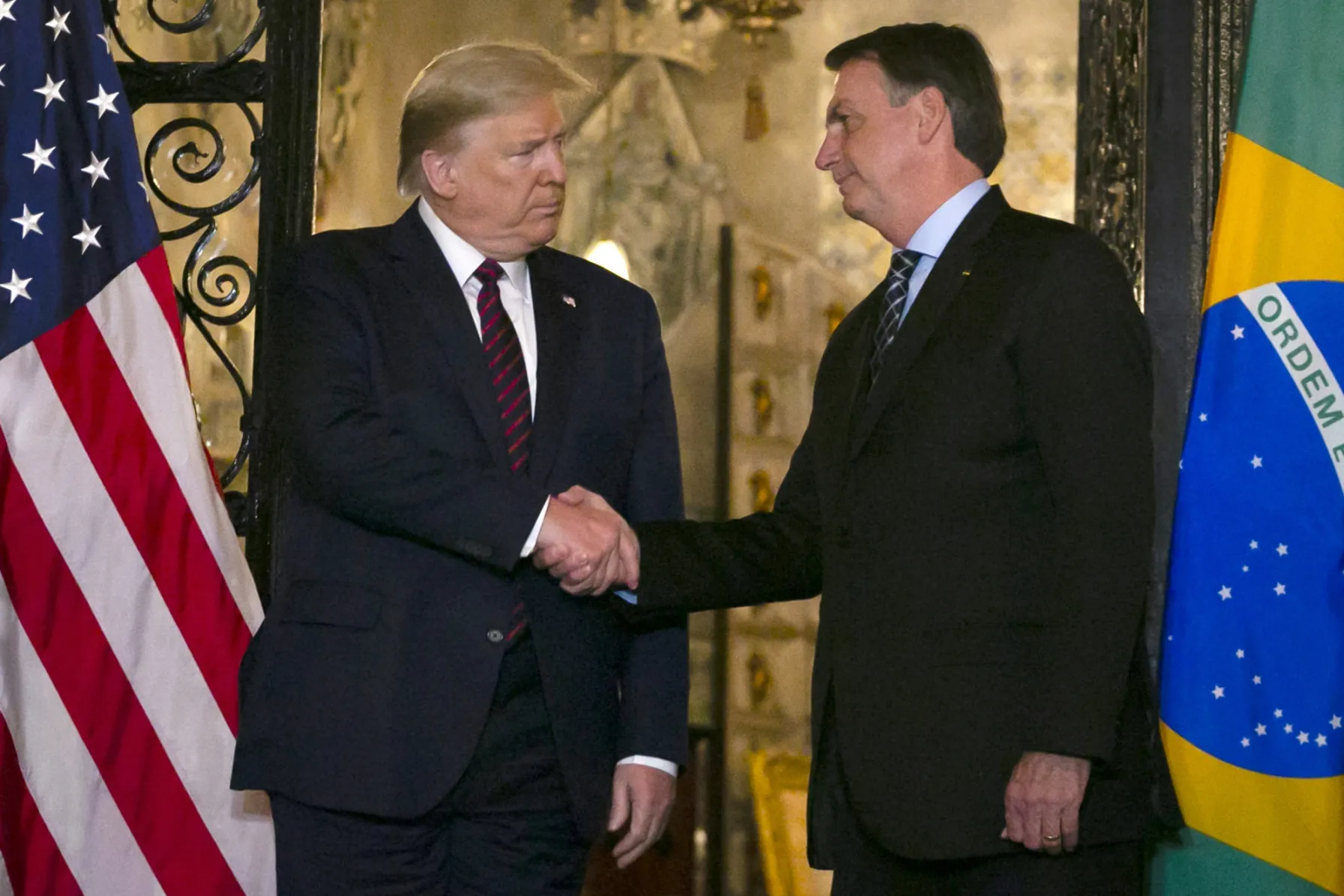  President Trump shakes hands with Jair Bolsonaro at Mar-a-Lago resort on March 7.