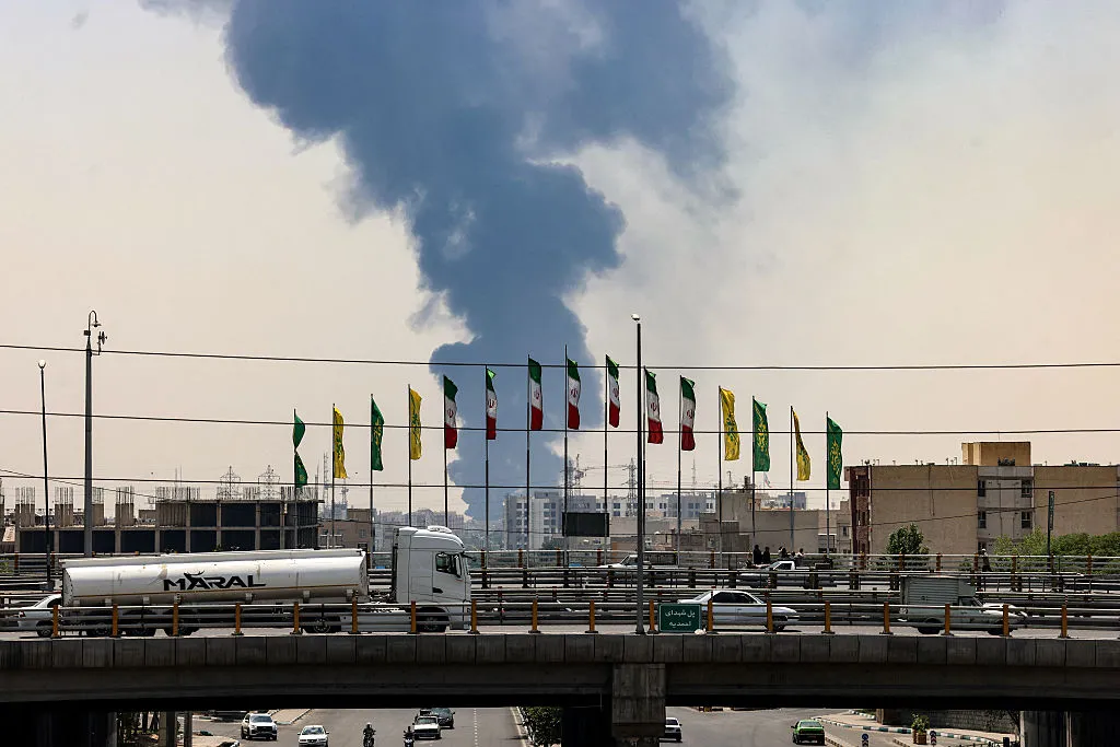 Smoke rises following an Israeli airstrike in southern Tehran, on June 15.