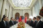 Donald Trump, Xi Jinping, and members of their delegations during their bilateral meeting on Dec. 1.