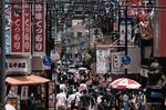 Pedestrians walk through a restaurant district in the Shinsekai neighborhood in Osaka, Japan, on Sunday, June 19, 2022. Japan is scheduled to release consumer price index (CPI) figures on June 24.