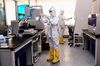 Laboratory technicians work on testing samples from people to be tested for the COVID-19 coronavirus at a laboratory in Shenyang in China's northeastern Liaoning province on Feb. 12, 2020.