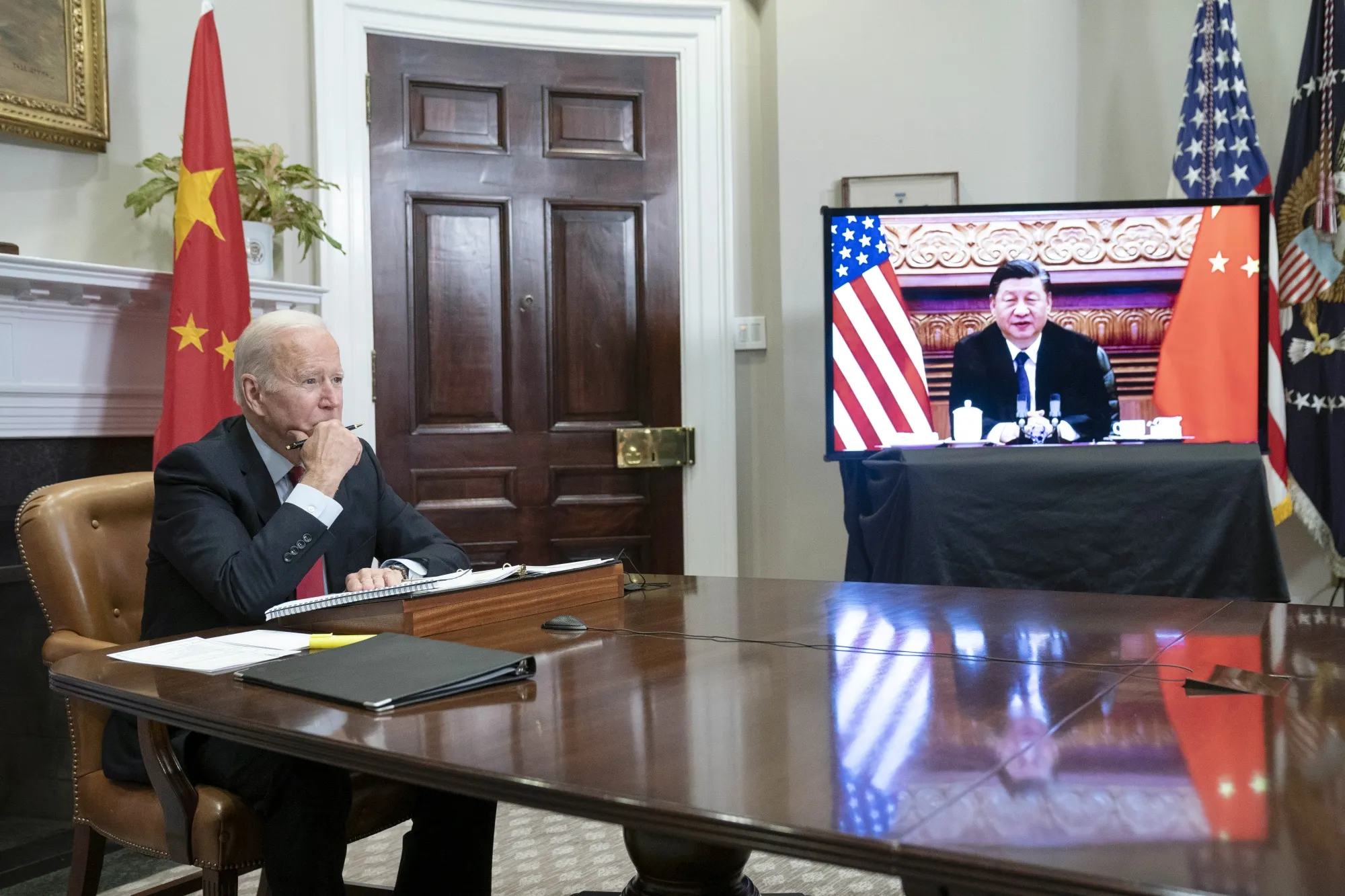 Joe Biden listens while meeting virtually with Xi Jinping in the Roosevelt Room of the White House on Nov. 15.