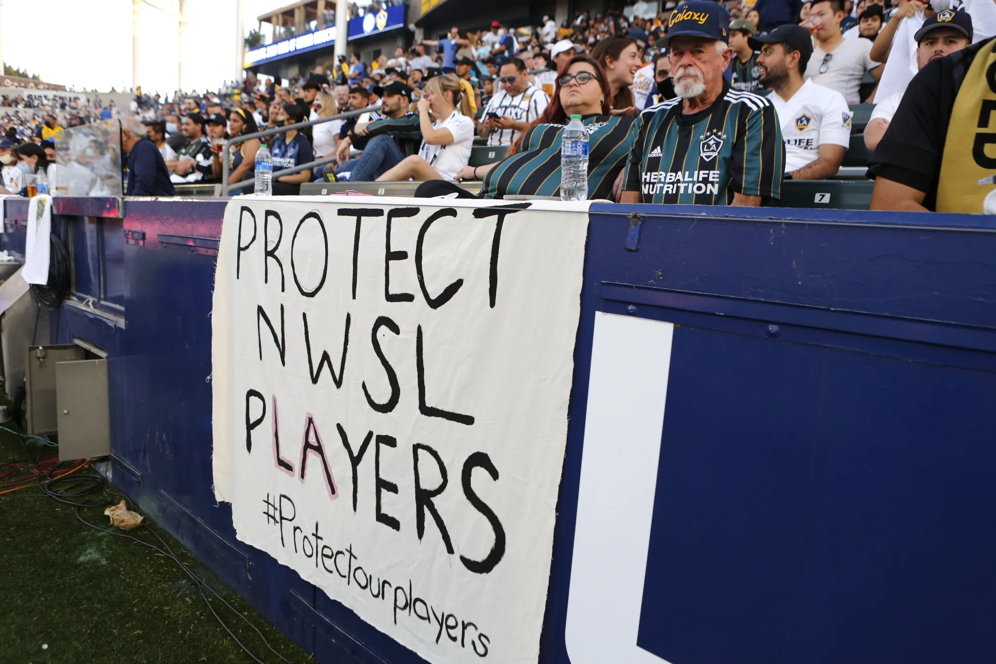 Signage supporting NWSL players is seen during a game between the Los Angeles Galaxy and the Los Angeles FC in Carson, California.