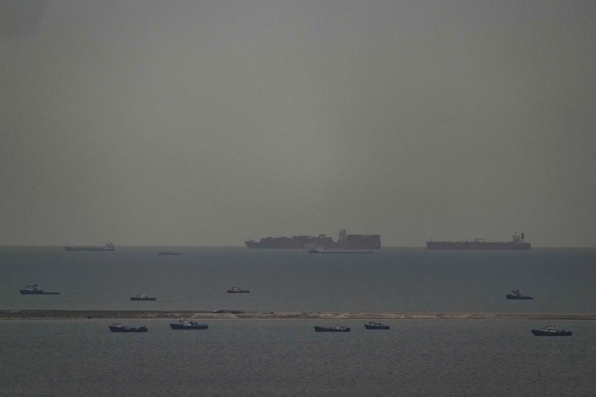 Cargo ships in the Arabian Gulf move toward the Strait of Hormuz off the United Arab Emirates on March 27.