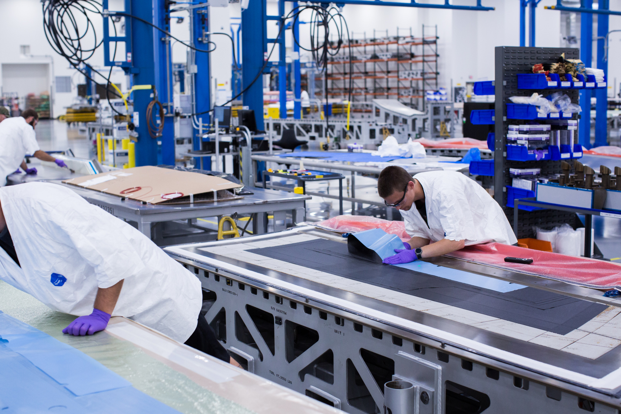 Employees perform quality checks on components for a Boeing Co. 777X commercial aircraft at the Boeing Defense, Space &amp; Security facility in St. Louis, Missouri, U.S.