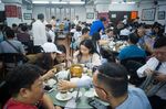 Diners share tables as they eat dim sum at the Lin Heung Tea House in Hong Kong in 2018.&nbsp;