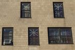 Tape covers the windows at a public housing complex on Coney Island after Hurricane Sandy.