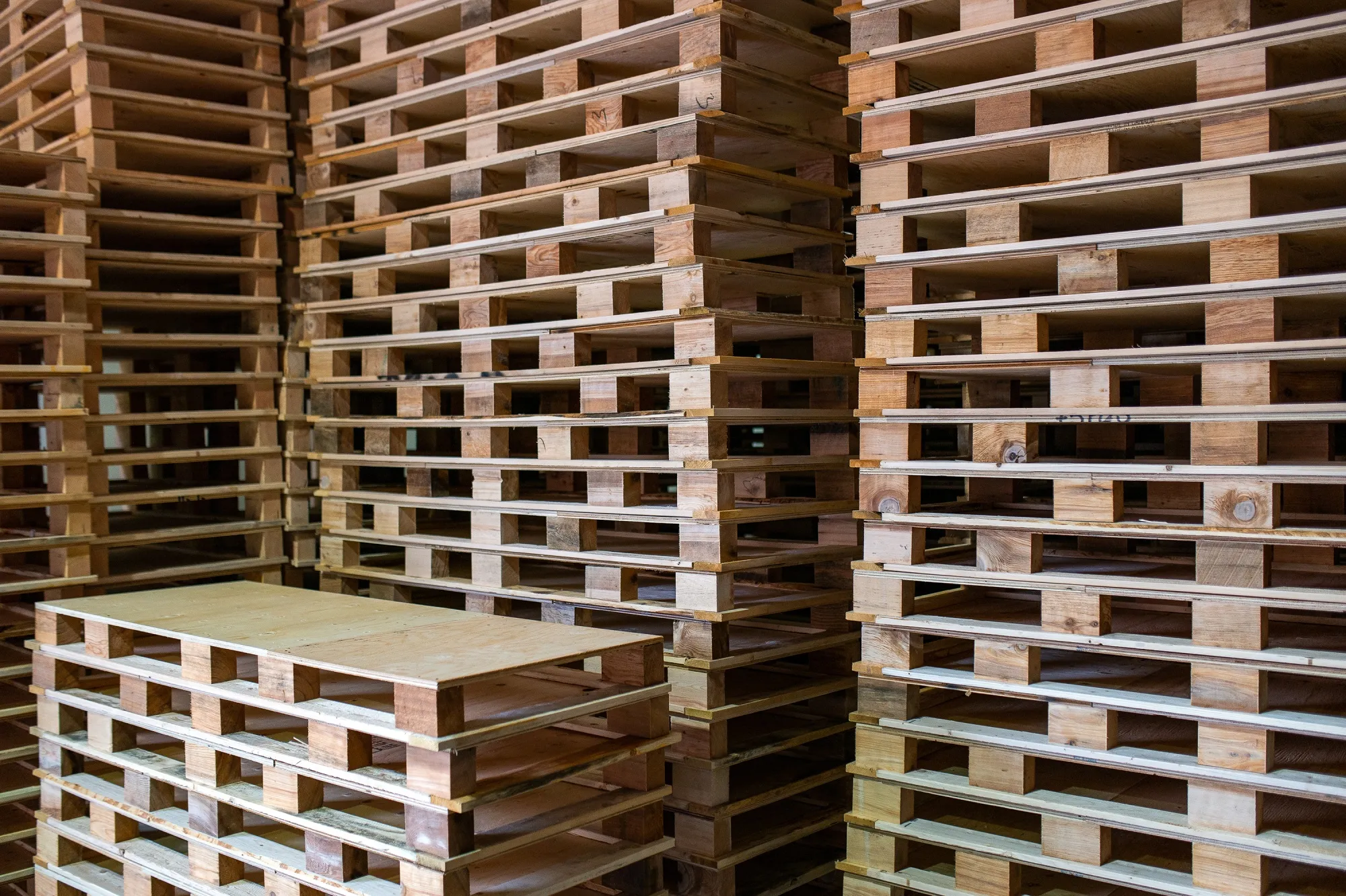 Stacks of custom, manually made pallets, in a warehouse at Pacific Pallet in Abbotsford, Canada, on April 1