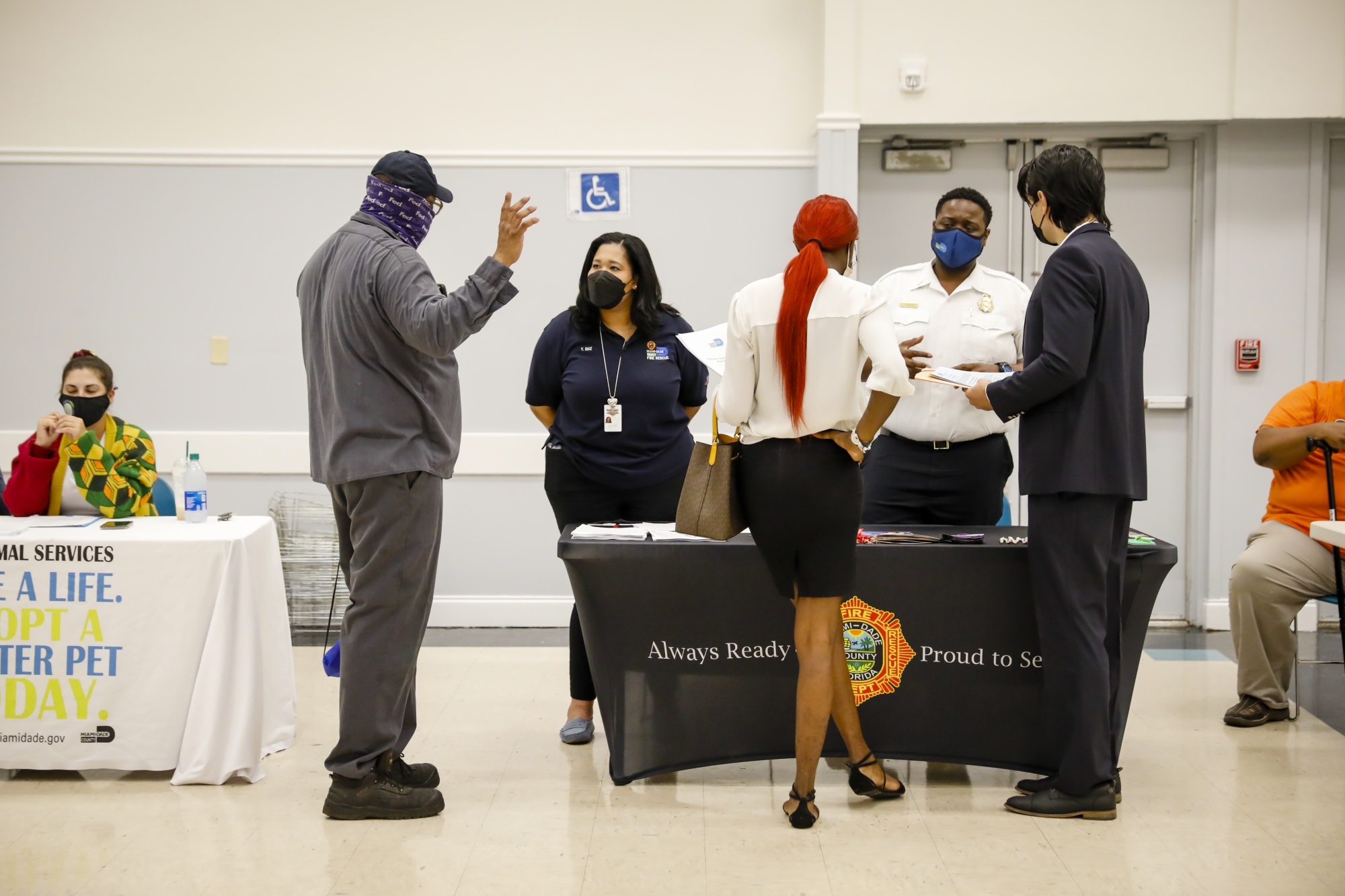 Recruiters speak with job seekers during a Miami-Dade County job fair in Florida on Dec. 16.