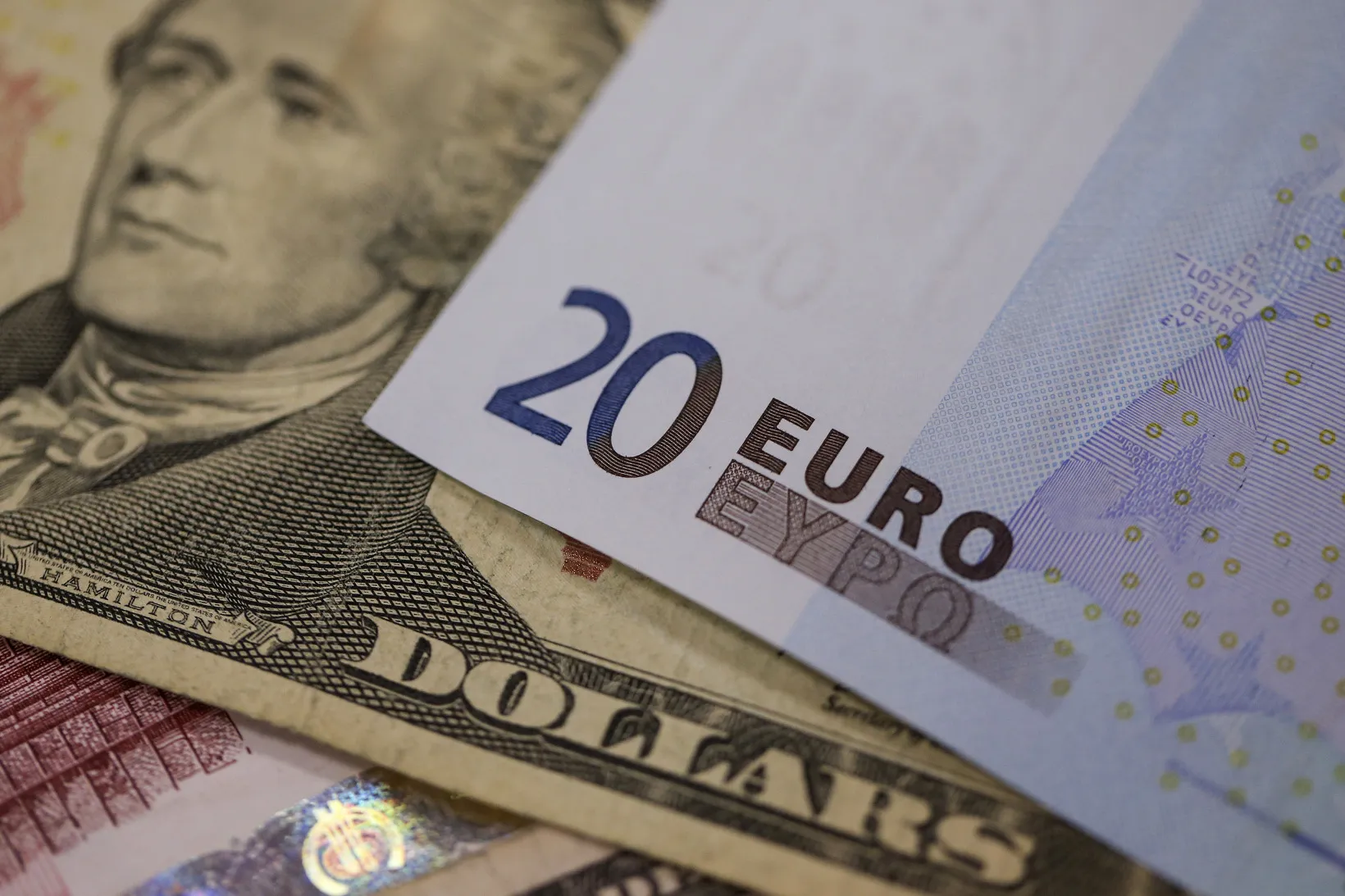 A U.S. ten dollar bill sits alongside a twenty euro banknote in this arranged photograph taken inside a Travelex store, operated by Travelex Holdings Ltd., in London, U.K.