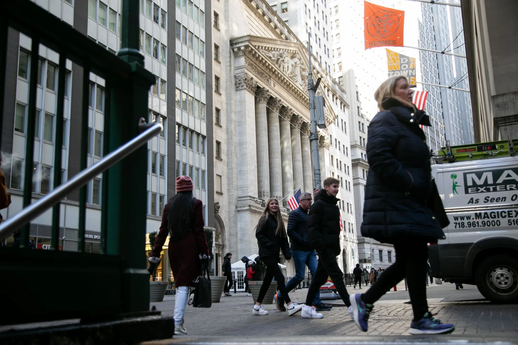 Pedestrians in front of the New York Stock Exchange (NYSE) in New York, US, on Friday, Feb. 16, 2024. Wall Street is ending the week on a bit of a sour note, with stocks and bonds falling after economic data continued to fuel speculation the Federal Reserve will be in no rush to cut interest rates.