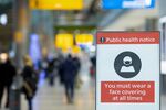 A Covid-19 safety sign at London Heathrow Airport Ltd. in London, U.K., on Monday, Nov. 29, 2021.