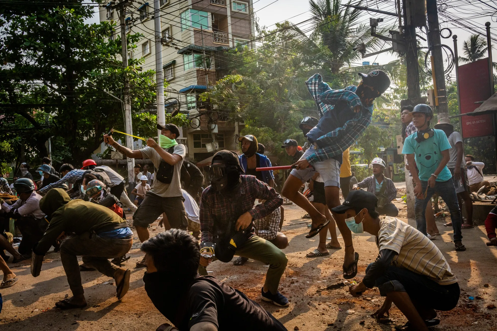 Anti-coup protesters clash with security forces in Yangon on March 28.