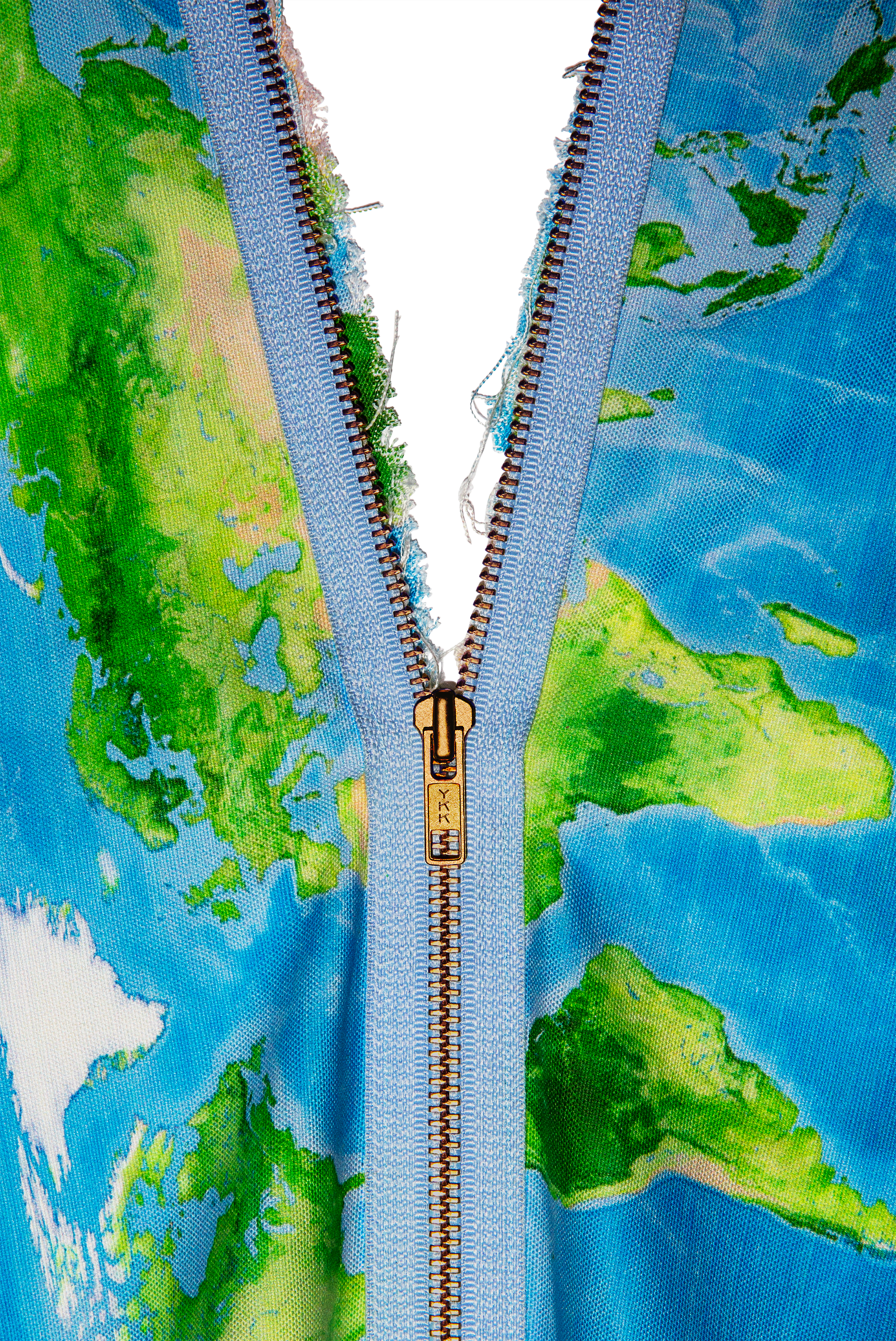 Zipper on fabric imprinted with world map.