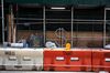 A dollar sign bike rack, designed by David Byrne, stands surrounded by scaffolding and construction material along Wall Street in New York, U.S., on Monday, July 20, 2020. U.S. stocks fluctuated in light trading as investors are keeping an eye on Washington, where lawmakers will begin hammering out a rescue package to replace some of the expiring benefits earlier versions contained.