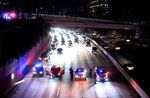 California Highway Patrol officer stop the flow of traffic on the 110 freeway as protesters unsuccessfully attempted to rush the freeway in a November 11, 2016, rally to oppose the election of President Donald Trump.