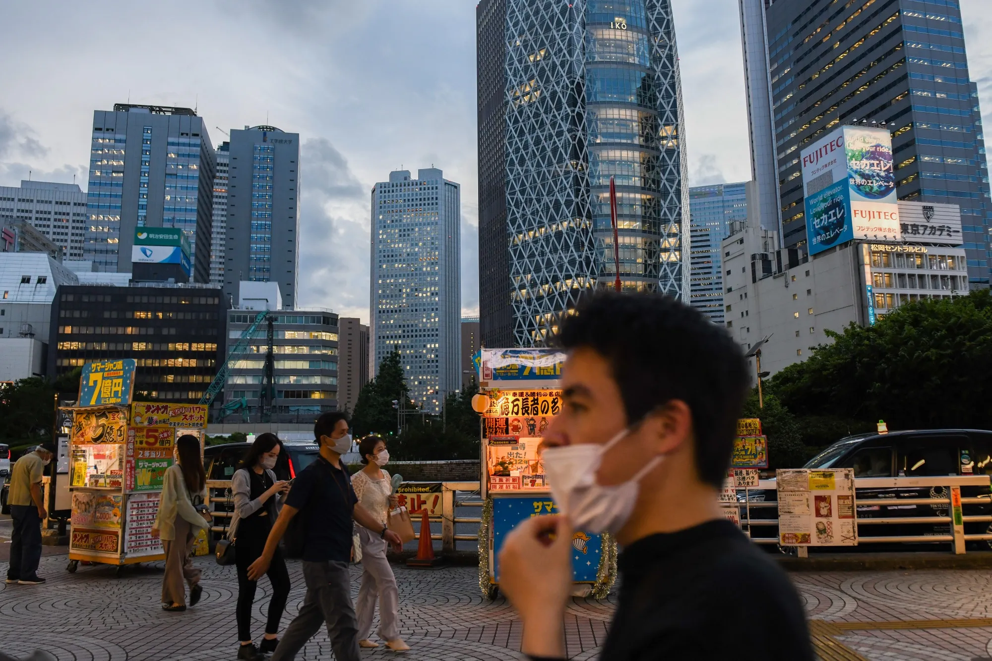 Evening commuters in the Shinjuku district of Tokyo.