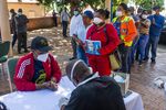 Residents&nbsp;queue to speak to a health worker during a screening in Rustenburg, South Africa on April 7.