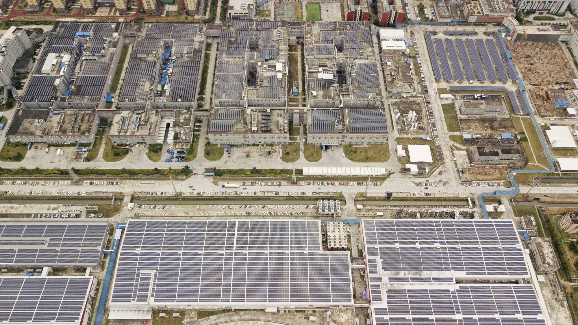 Solar panels are seen on rooftops at the Contemporary Amperex Technology Ltd. (CATL) headquarters and manufacturing complex in this aerial photograph taken in Ningde, Fujian Province, China, on Jan. 29, 2018. CATL already sells the most batteries to the biggest electric-vehicle makers in the biggest EV market: China.&nbsp;