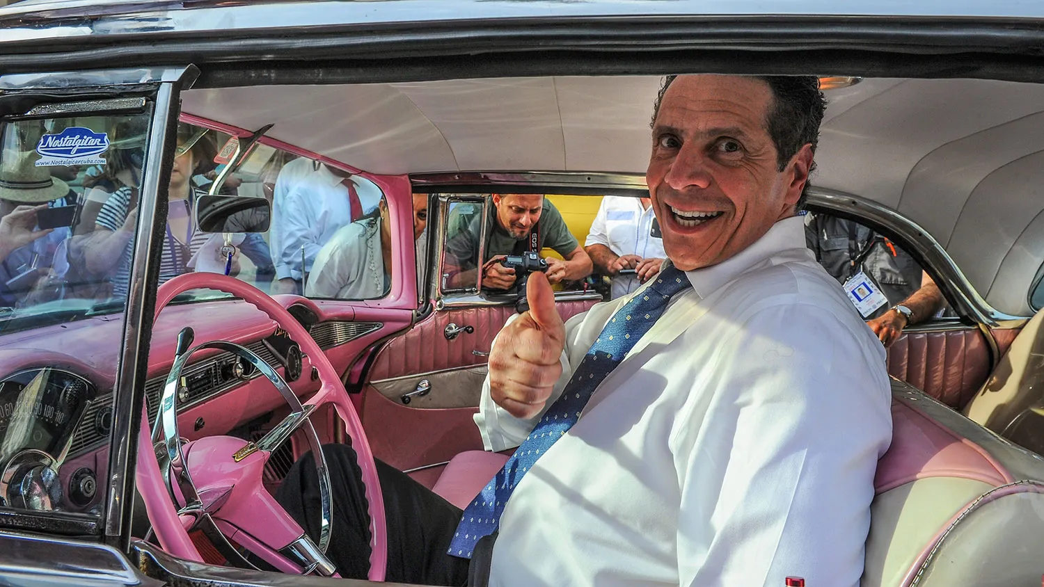 New York Governor Andrew Cuomo sits inside a vintage US car, on April 20, 2015.
