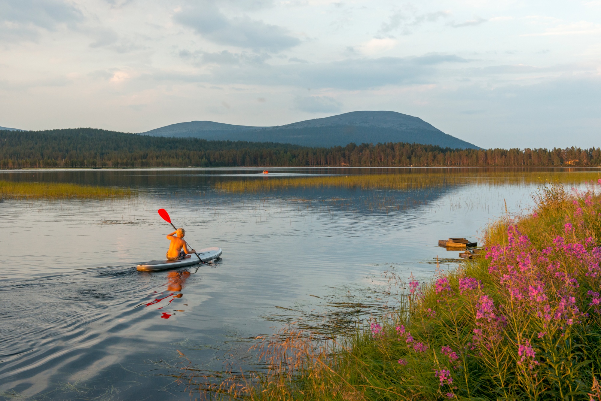 A kayaker paddles through one of Finland's 188,000-plus lakes.