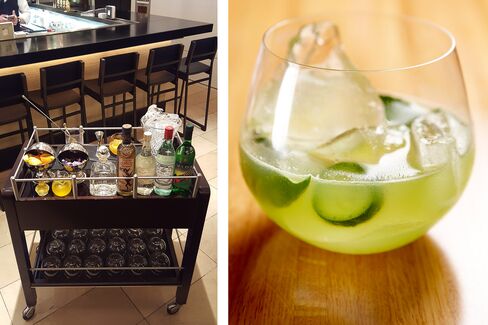 The Tequila Manhattan cart at Wolfgang Puck's Cut in Las Vegas, and a finished drink made with Patron Platinum, house-infused orange syrup and hand-chipped ice.