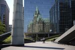 A pedestrian walks through the plaza garden of the Bank of Canada in Ottawa last year. 