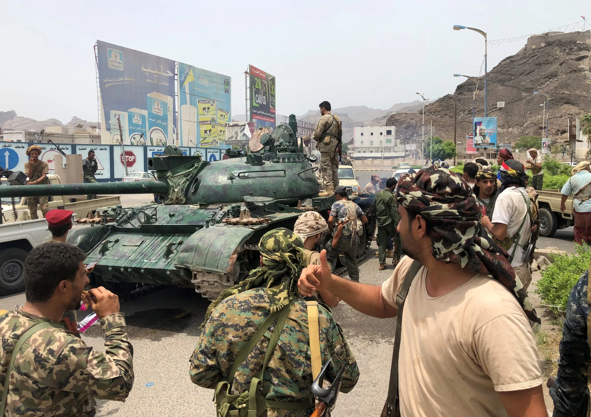 Supporters of the southern separatists pose for a picture with a tank in Aden on Aug. 10.