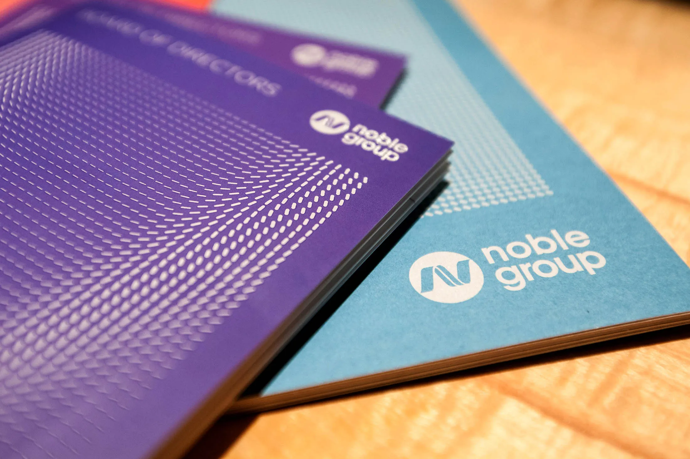 Noble Group Ltd. booklets sit on a table before a news conference during an investor day in Singapore, on Monday, Aug. 17, 2015. Noble Group Ltd. pledged to increase operating profit to more than $2 billion in the next three to five years as Asia's largest commodity trader sought to reassure investors about its long-term prospects.
