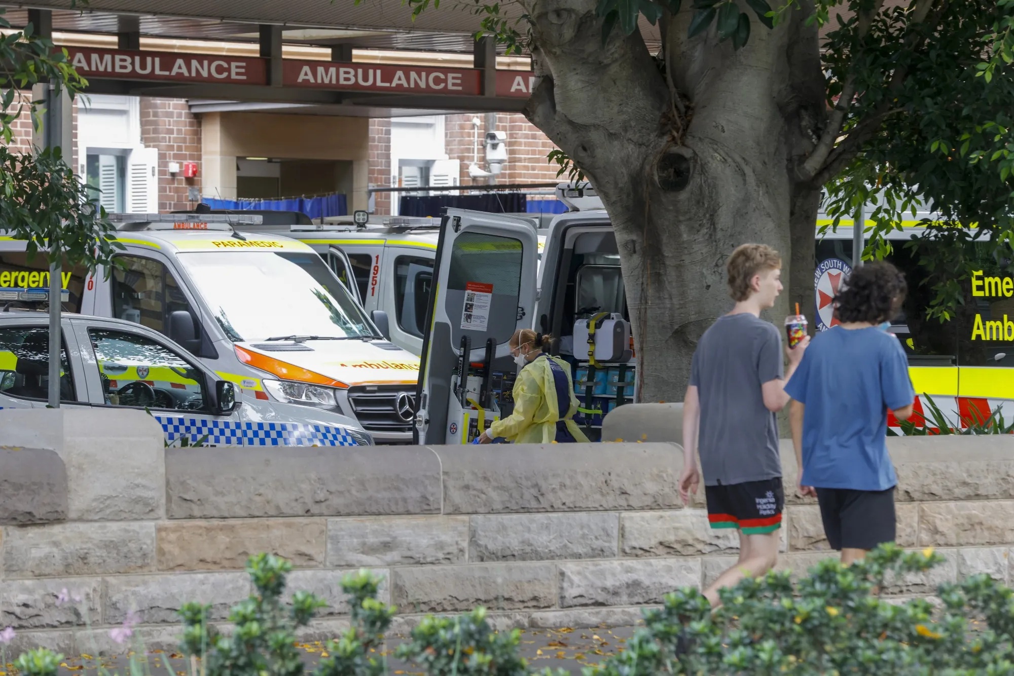 Medical workers at the Royal Prince Alfred Hospital ambulance entrance in Sydney on Jan. 10.