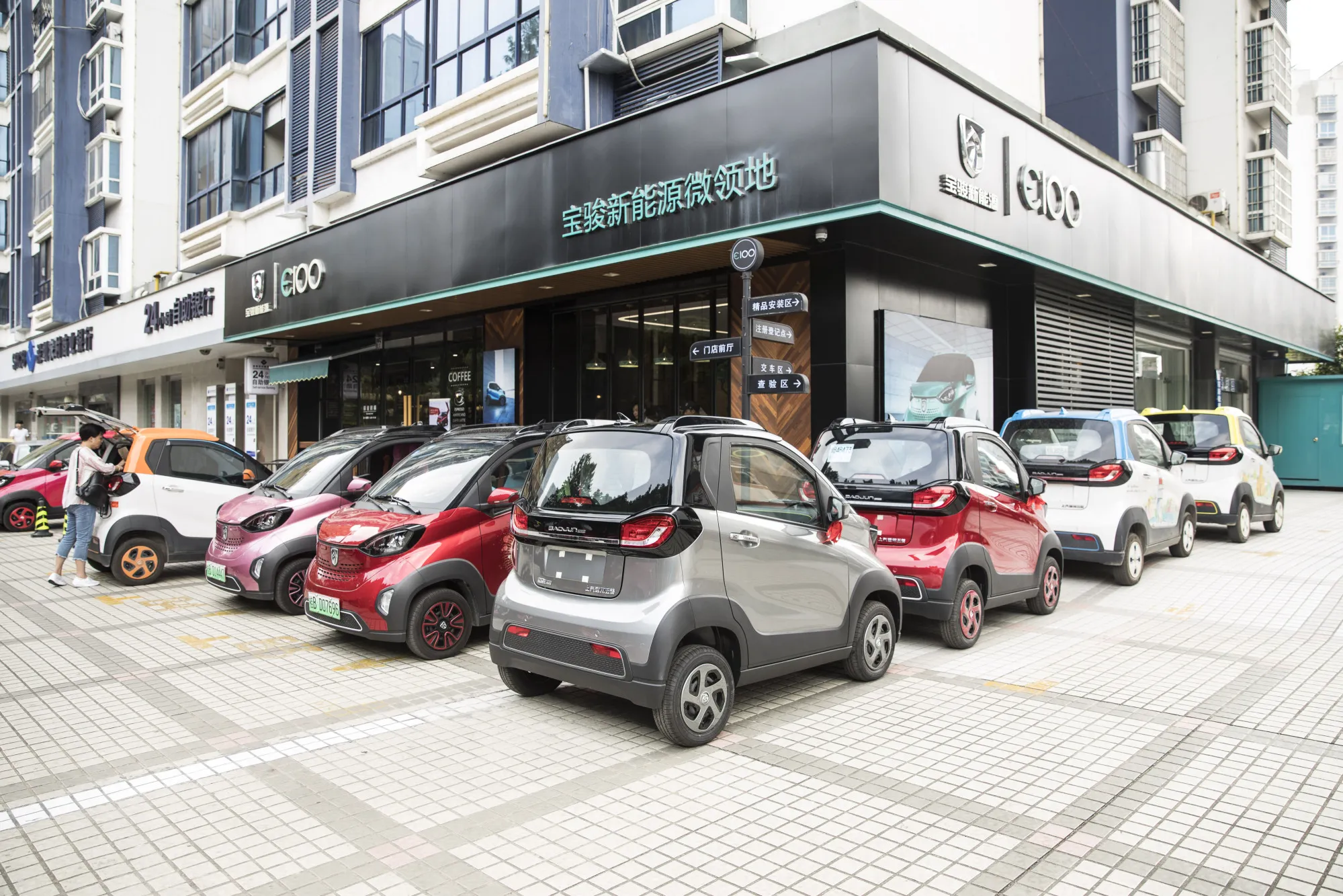 Baojun E100 electric vehicles&nbsp;outside a SAIC-GM-Wuling Automobile Co. Baojun E100 Customer Experience Center, in Liuzhou, China.&nbsp;