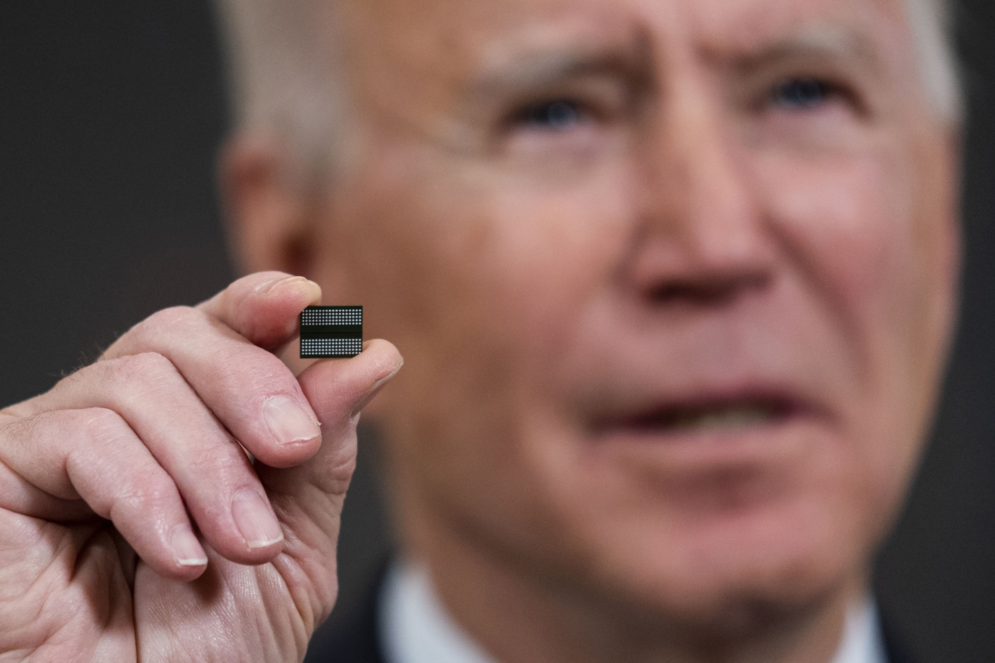 US&nbsp;President Joe Biden holds a semiconductor before signing an executive order at the White House in Washington, on Feb. 24, 2021.