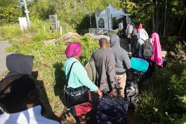 TOPSHOT-US-CANADA-IMMIGRATION-HAITI-QUEBEC