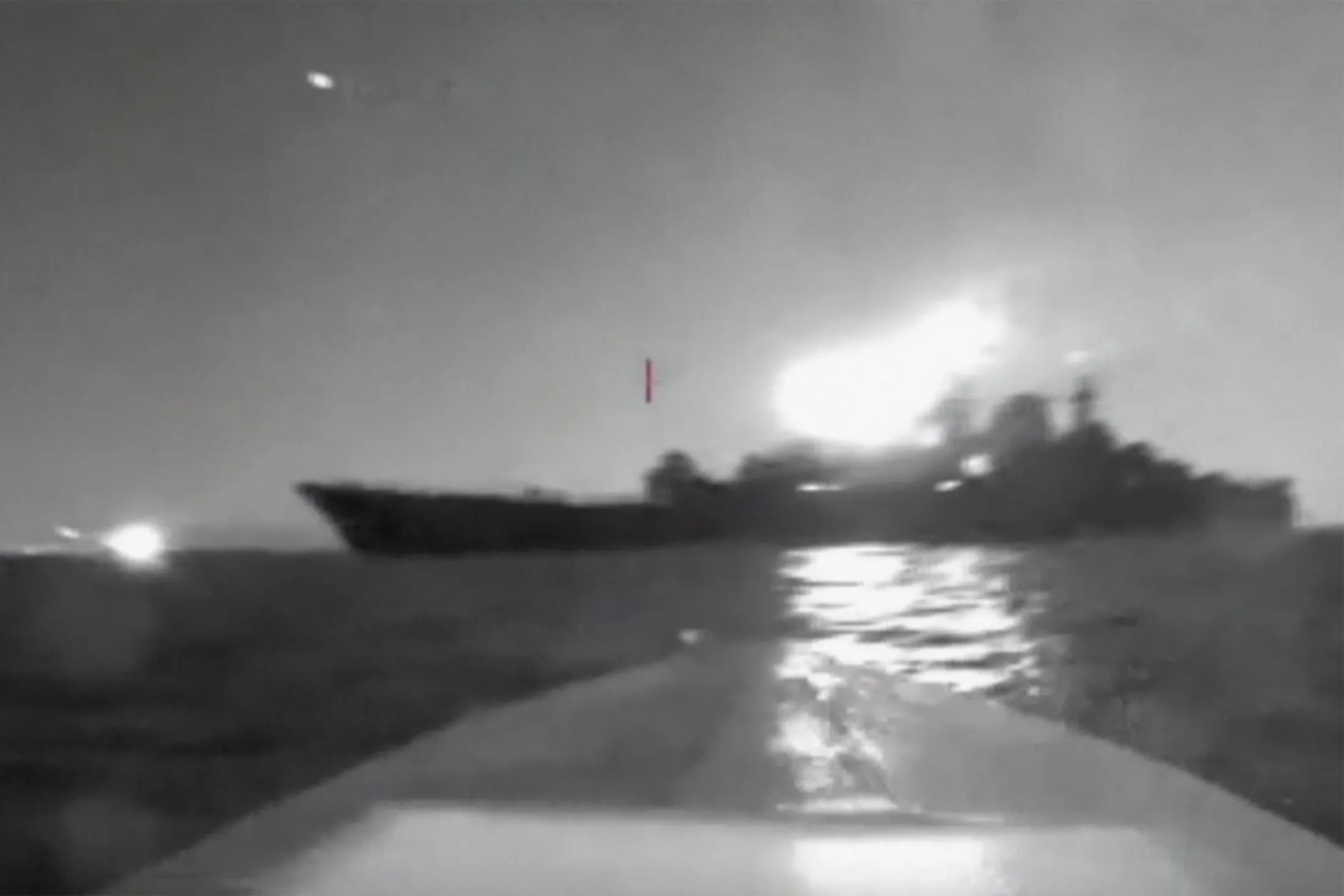 In this grab taken from video released on Friday, Aug. 4, 2023, a&nbsp;drone maneuvers as it approaches a vessel claimed to be a Russian large landing ship&nbsp;close to the Black Sea port of Novorossiysk.