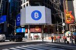 Monitors display Coinbase and Bitcoin signage during the company's initial public offering (IPO) at the Nasdaq MarketSite in New York, U.S., on Wednesday, April 14, 2021.&nbsp;